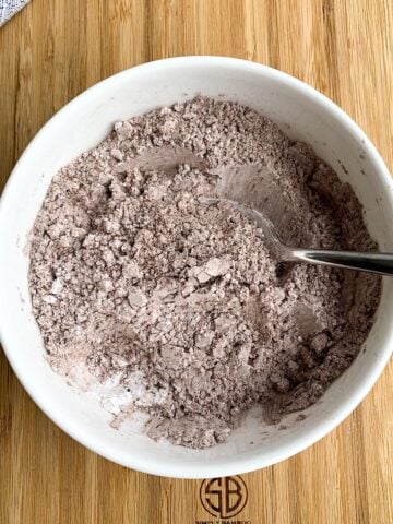 brownie icing dry ingredients in a white bowl. 