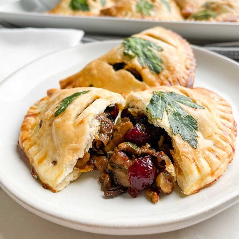 baked vegetarian empanadas on a white plate