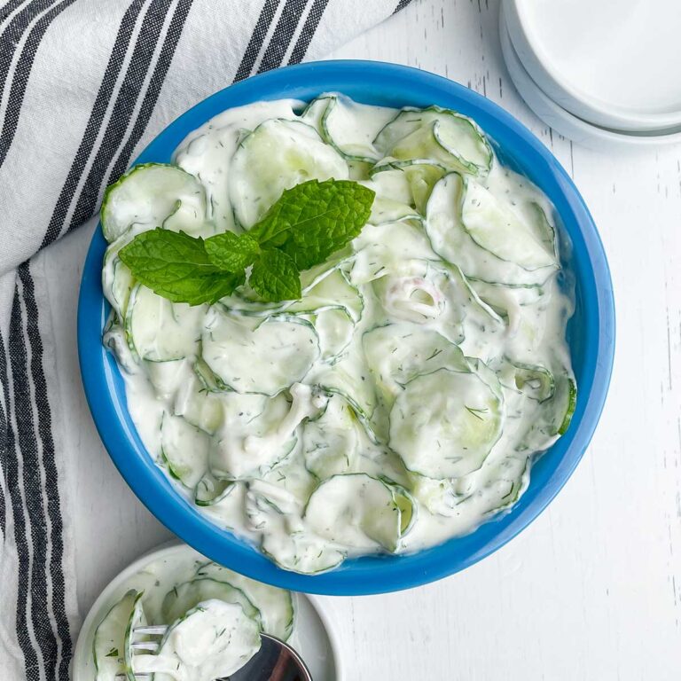 blue bowl of tzatziki greek cucumber salad