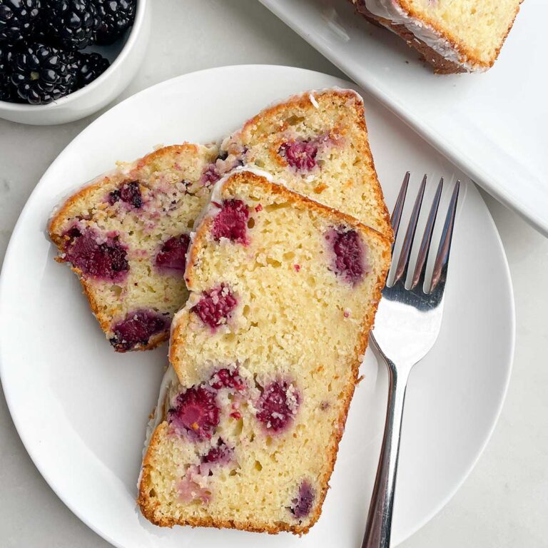 slices of lemon blackberry bread on a white plate