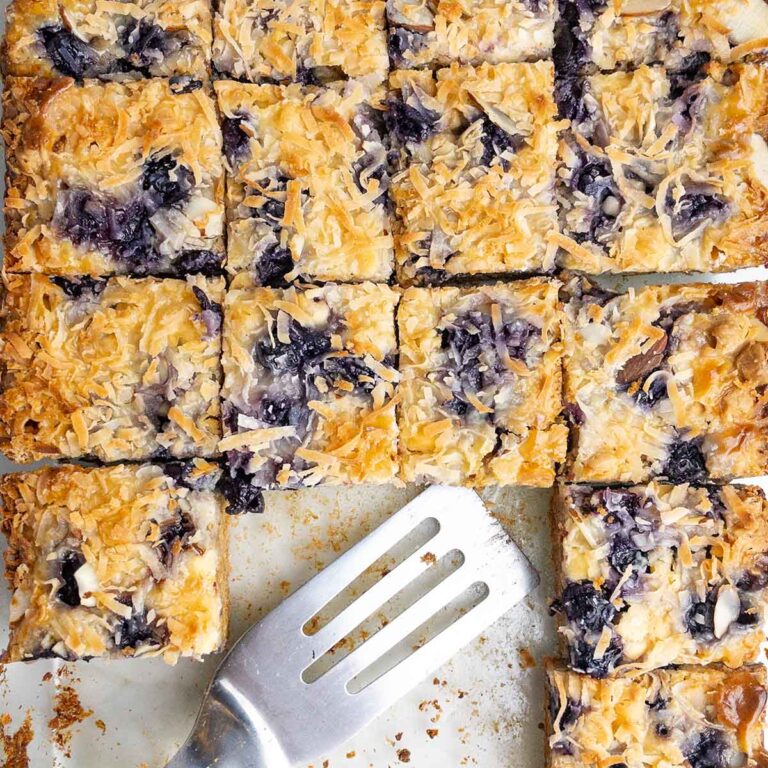 blueberry white chocolate sugar cookie mix bars in a glass pan.
