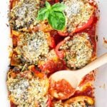 vegetarian Italian stuffed peppers in a white baking dish.