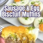 hand holding a sausage egg and biscuit muffin with a bite taken out.