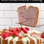 cake server holding a piece of strawberry angel food cake above the cake on a plate.