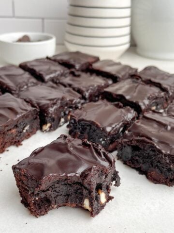 triple chocolate brownies frosted in brownie icing. 