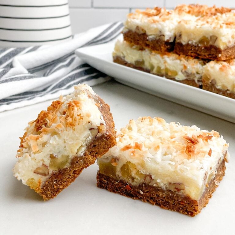 two carrot cake mix bars on a a white counter top.