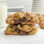 two halves of an oatmeal craisin cookie stacked on each other.