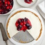 cheesecake with cherry topping, a piece of cheesecake with cherry topping, and a bowl of cherry topping