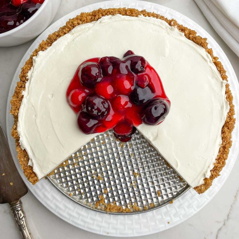 partial cheesecake with cherry topping