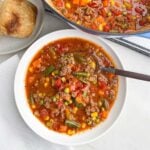 ground beef vegetable soup recipe in a white bowl
