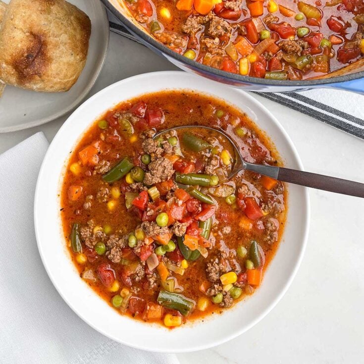 ground beef vegetable soup recipe in a white bowl
