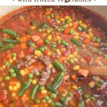 ground beef vegetable soup in a Dutch oven.