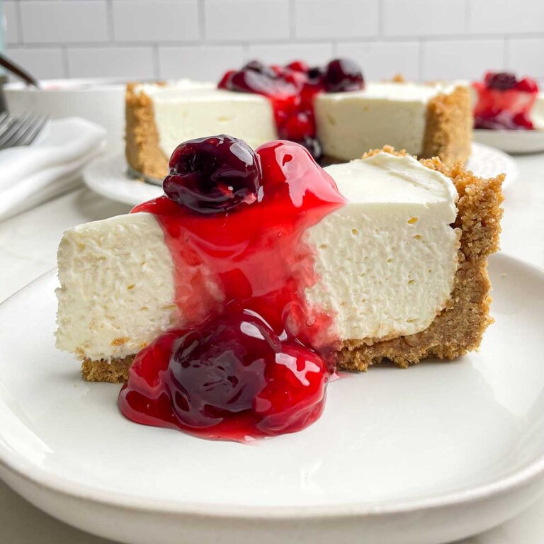 piece of no-bake cheesecake with cherry topping