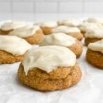 frosted gingerbread cookies on parchment paper