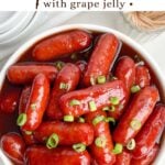 grape jelly little smokies in a white bowl.