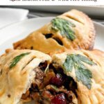 baked vegetarian empanadas on a white plate.