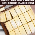 lemon bars on a wood cutting board.