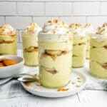 banana pudding cup in a mason jar on a white plate