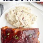 roaster oven ribs and mashed potatoes on a white plate.