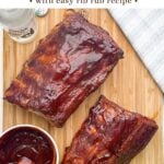 bbq ribs on a wooden cutting board.