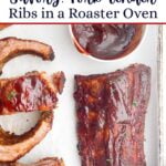 bbq ribs on a baking sheet with parchment.