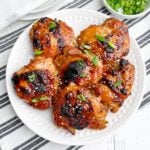 oven baked teriyaki chicken thighs on a white plate