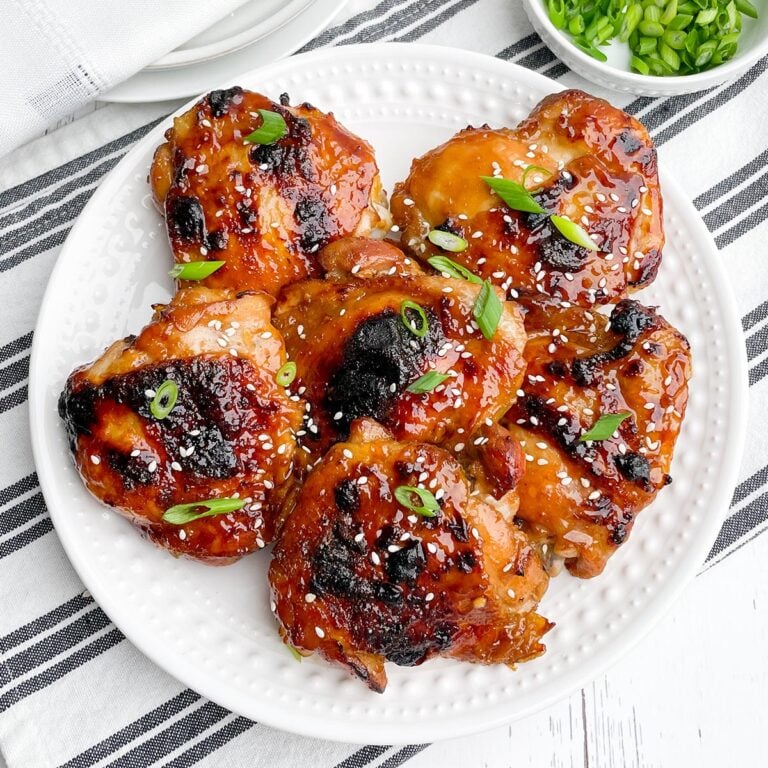 oven baked teriyaki chicken thighs on a white plate