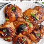 oven baked bone-in teriyaki chicken thighs on a white plate.