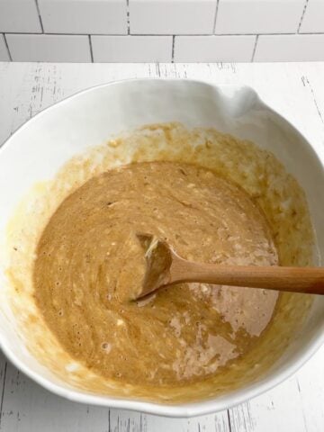 banana zucchini bread batter in white mixing bowl