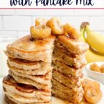 a stack of banana pancakes with caramelized banana topping on a white plate.