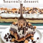 fork piercing through a piece of peanut butter oreo heavenly dessert on a white plate.