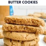 a stack of brown butter peanut butter cookies on parchment paper.