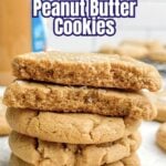 a stack of brown butter peanut butter cookies on parchment paper.
