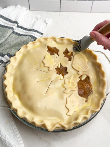 Pie dough top with cookie cutter cutouts.