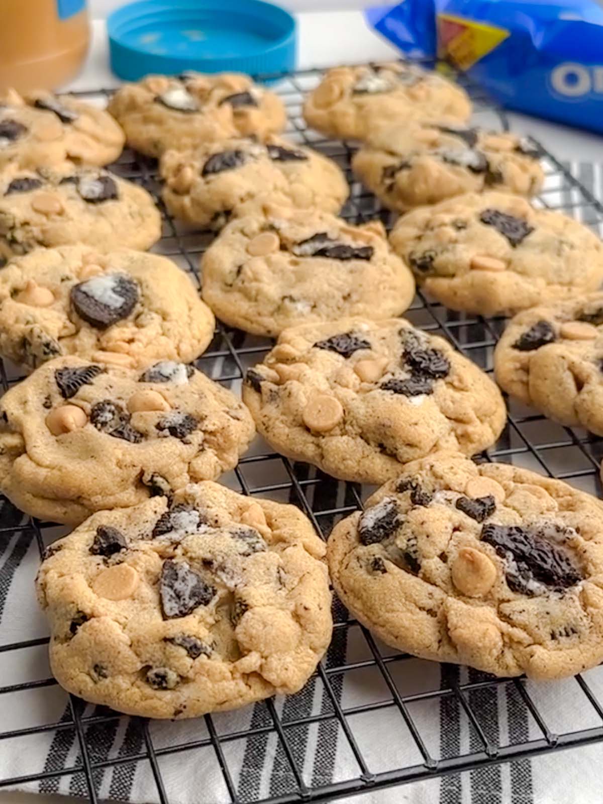 peanut butter cookies with oreos on a baking rack.