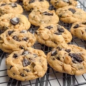 peanut butter cookies with oreos on a baking rack.