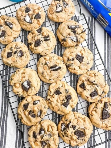 Peanut butter Oreo cookies on a wire baking rack.