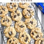 peanut butter cookies with oreos on a baking rack.