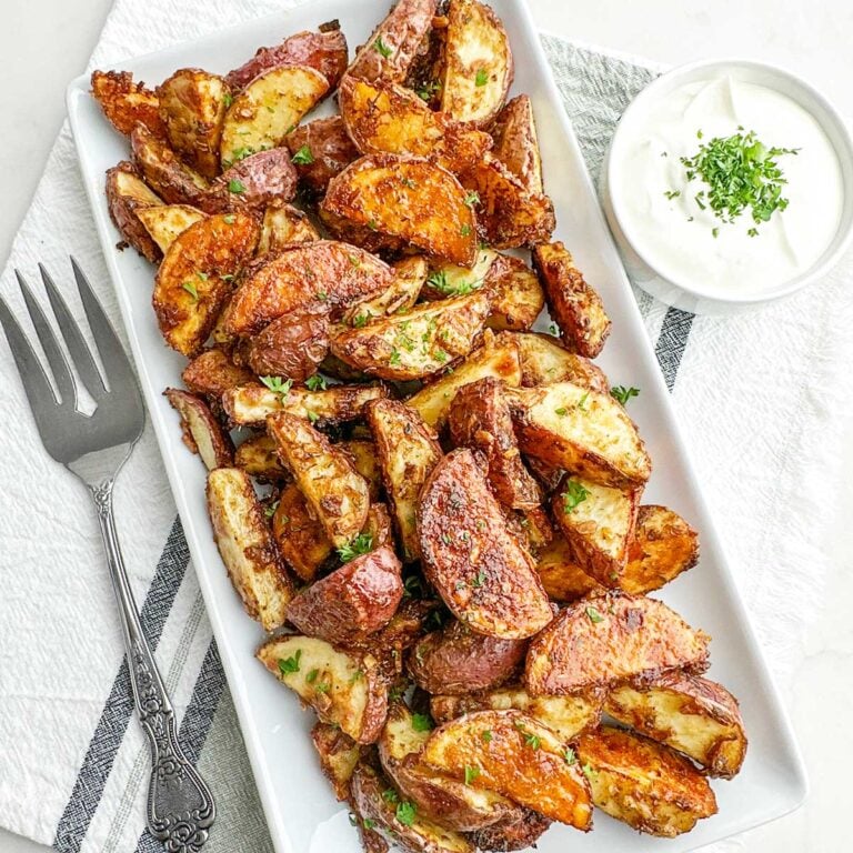 lipton onion soup mix roasted potatoes on a white platter.