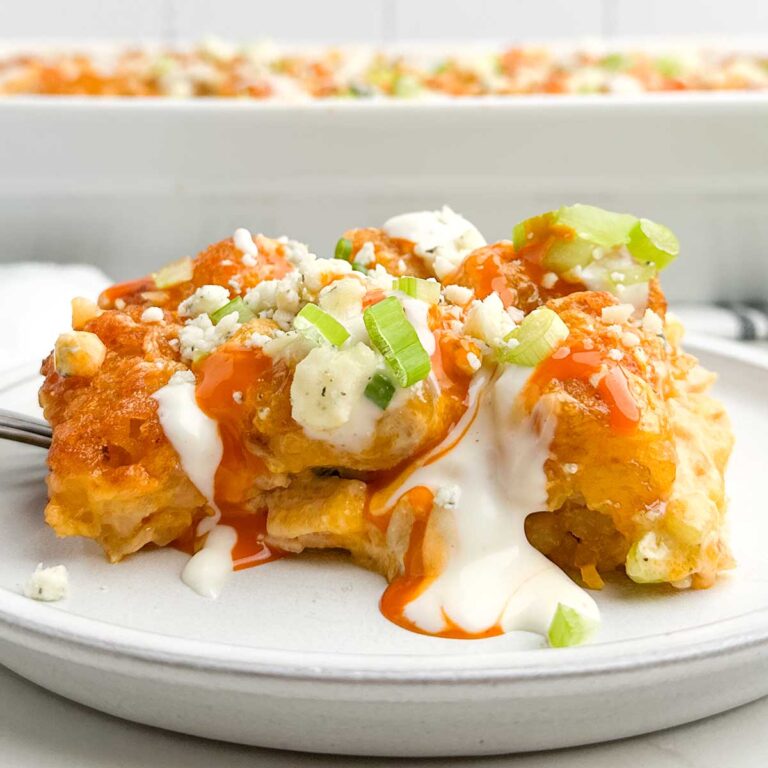 buffalo chicken tater tot casserole on a white plate.