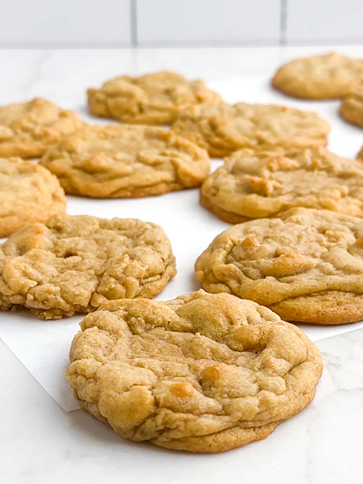chocolate chipless cookies on a white countertop.