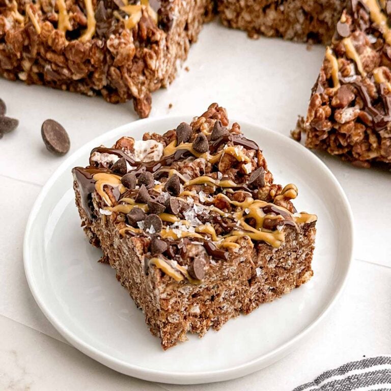 peanut butter rice krispie bar on a white plate.