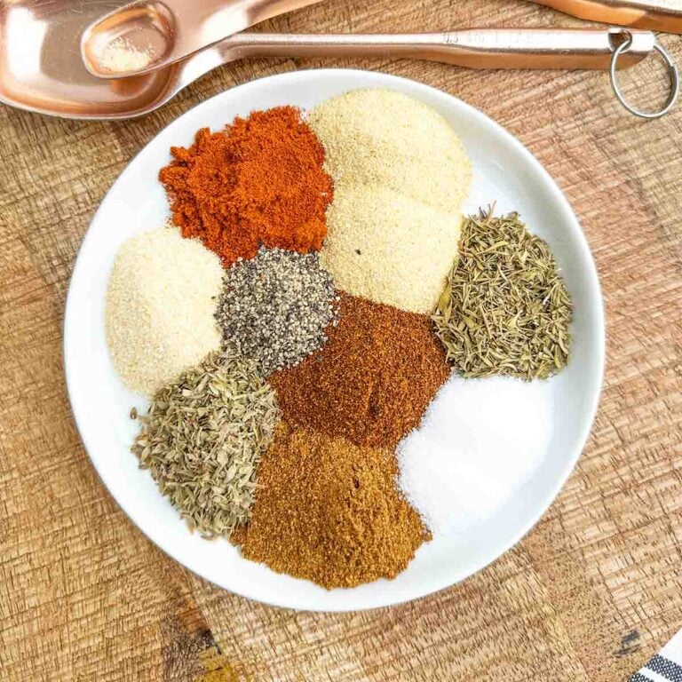 blackened Cajun seasoning ingredients on a white plate.