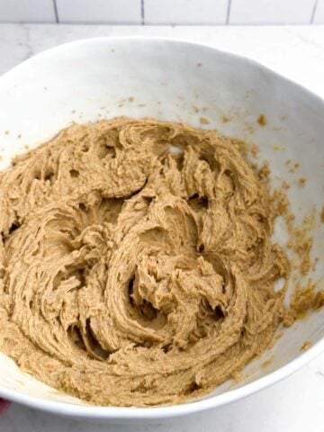 wet ingredients combined in a white mixing bowl.