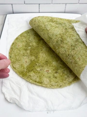 tortillas between paper towels.
