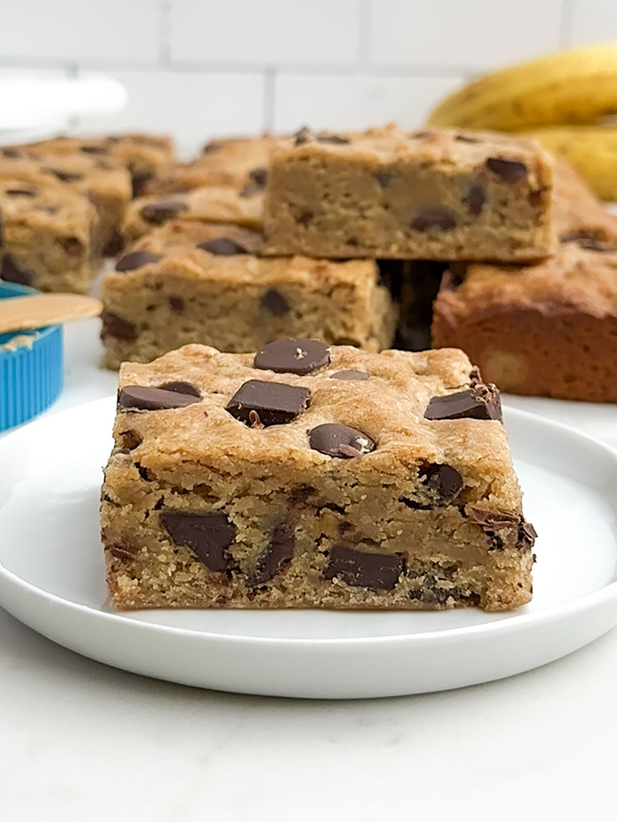 a banana blondie on a white plate.
