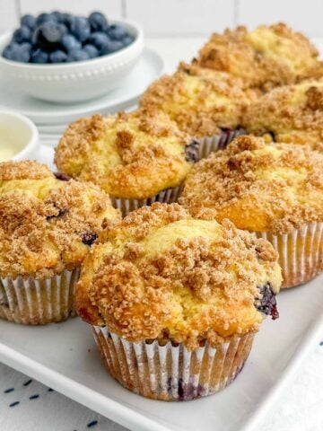 cake mix blueberry muffins on a white platter.