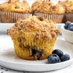 a cake mix blueberry muffin on a white plate.