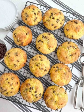 baked chocolate chip cake mix muffins on a wire rack.