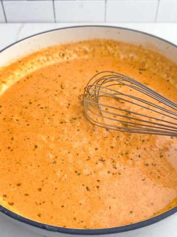 sundried tomato pesto sauce in a Dutch oven.